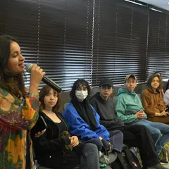 Leading a vocal session with an engaged group of learners. My goal is to create a comfortable space where everyone feels they can participate, listen, and contribute to the music we're making.