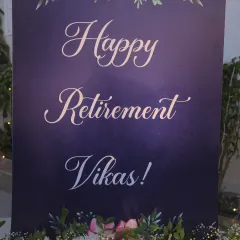 A personalized welcome sign for the retirement party, elegantly designed with a floral motif.