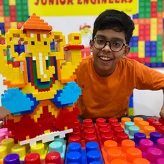 A proud student shows off the large, colorful LEGO Ganesha idol he built during our popular festive workshop. This is a perfect example of how we blend cultural traditions with hands-on engineering skills.