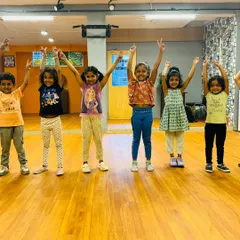 A moment of pure joy with my youngest group of dancers. These kids, aged 3 to 6, are striking a happy pose after a fun-filled session in the studio.