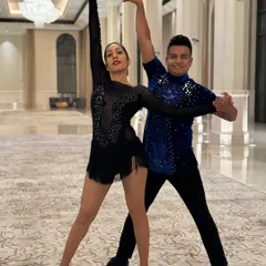 A powerful pose from a duet performance. We focus on creating strong, memorable stage pictures that capture the audience's attention. This showcases the precision and partnership in our Salsa and cabaret-style shows.
