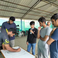 Success on the track starts with strategy in the pits. We dedicate time to classroom sessions, where our coaches use whiteboards to break down track maps, explain racing lines, and discuss strategy with our drivers.