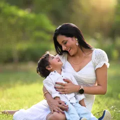 The bond between a mother and her son, bathed in the warm glow of golden hour light. I guide my clients into comfortable poses that feel natural, allowing for authentic moments of affection like this one.