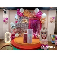 A complete Barbie-themed birthday party setup for an 8th birthday celebration. I handled everything from the silver sequin and pink fringe backdrop to the custom Barbie cutouts, marquee number, and themed cake pedestals.