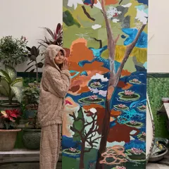 Here I am with a giant 7.5ft x 3ft canvas I made for a home in Mumbai. It's an abstract take on a lily pond, filled with raw textures and strokes that represent the cycle of life and harmony.