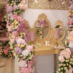 For Radhika Merchant's bachelorette, we created this glamorous vanity station, complete with a gilded triple mirror and surrounded by opulent arrangements of pastel roses and hydrangeas, fit for a princess.
