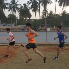 Athletes engaged in a rhythm running workout, a key session for improving endurance and learning to maintain a consistent pace during races.