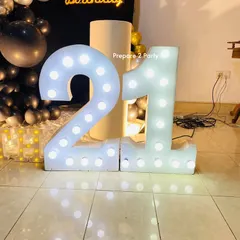 My 21st birthday decorations range from bold and modern to soft and elegant. I use marquee numbers, custom backdrops, and sophisticated balloon arrangements to mark this special occasion.