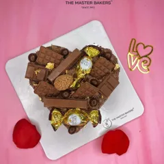For the ultimate chocolate lover, this heart-shaped cake is loaded with an assortment of chocolates like Ferrero Rocher and KitKat. It's a truly decadent way to celebrate your love.