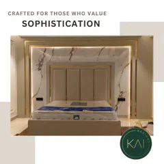 Elevate your bedroom into a luxurious retreat with our integrated design approach. This bespoke bed features a tall, panelled headboard set against a stunning marble wall with backlit gold accents, creating a dramatic and opulent focal point.