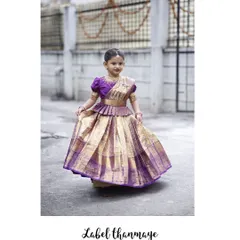 A beautiful purple and gold pattu pavadai. The pleats are designed to give the skirt a lovely flair when she walks and twirls.