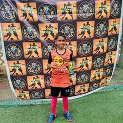 A player receiving an award at the 5v5 Sports Cup 3.0.