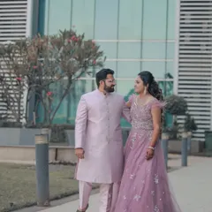 A stylish couple portrait set against a modern glass building. We love using contemporary architecture to create clean, elegant, and sophisticated pre-wedding photos.