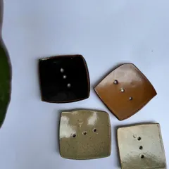 A collection of our square soap dishes in various glazes. Each one has drainage holes to keep your soap dry and lasting longer.