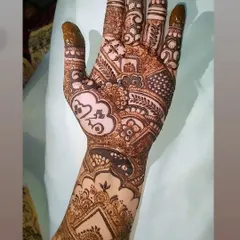 A full coverage bridal design that incorporates modern heart and cloud symbols. This is a great example of how we can weave your personal story into a traditional henna pattern.