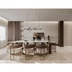 This modern dining area is defined by its sleek, minimalist aesthetic. The bird-inspired pendant light adds an artistic touch above the marble-topped table, while wood-paneled walls provide texture and warmth.
