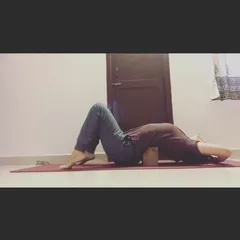 A yoga block can be a wonderful tool for opening the body. Here, I'm using a block under my upper back for a supported backbend. This helps to gently open the chest and shoulders, creating space and counteracting the forward hunch of desk work.