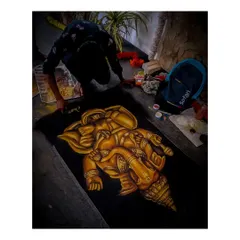 This photo shows me giving the final touches to my Lord Ganesha rangoli. Creating spiritual art like this is a meditative process, and I am honored to make these pieces for festivals and sacred occasions.