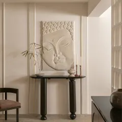 The journey into 'Olavu' begins here. A vintage-inspired partition sets a tone that is traditional in spirit but modern in presence. A serene, carved Buddha and a quiet console table come together to create a moment of stillness as you enter.