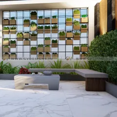 A closer view of the vertical garden installation on this rooftop. We use a grid-based system with individual planters to create a stunning green wall that is both beautiful and easy to maintain, serving as the focal point for the modern outdoor seating area.