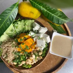 Enjoy the taste of summer with our Mango Extravaganza Salad. This dish beautifully combines sweet mango, creamy paneer, crunchy peanuts, and fresh cucumber over a bed of nutritious quinoa.