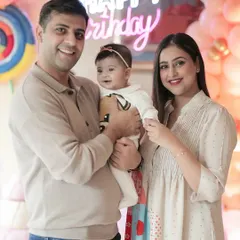 A happy family portrait during a half-birthday celebration. These photos are perfect for sharing with family and friends to celebrate your child's milestones.