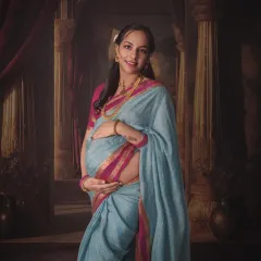 Tradition holds so much beauty. This portrait, inspired by classic paintings, blends the elegance of a traditional saree with the timeless story of motherhood, creating a true heirloom image.