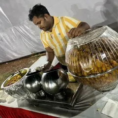 A live pani puri counter is always a hit. Here, my staff is serving freshly made pani puri to guests at a 58th birthday party in Vashi.
