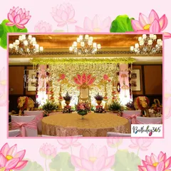 A wider view of the royal stage setup, showing how guest seating can be arranged around the main ceremonial area. The decor is consistent, with pink bows on chairs complementing the gold and floral stage design.