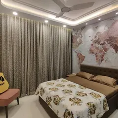 A well-designed room should have space for your passions. We ensured this bedroom layout included a cozy corner for our client to relax with their guitar, demonstrating how we incorporate personal lifestyle elements into our interior designs.