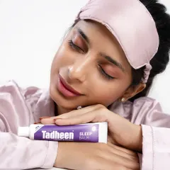 A serene beauty shot for the Tadheen sleep balm. The model's peaceful expression and closed eyes perfectly convey the sense of calm and relaxation associated with the product.