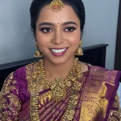 A closer look at the intricate details of the layered temple necklaces. The set includes a choker and a longer haram, both featuring traditional motifs that are central to South Indian bridal jewellery.