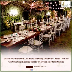 A beautiful al fresco dining experience with a long wooden table set under a canopy of trees and twinkling lights, perfect for an intimate evening celebration.