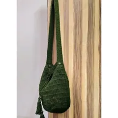 This custom-made jhola bag in a deep olive green features a drawstring closure and handmade tassels. It's a perfect example of how we can tailor a design to your favorite color.