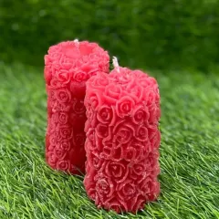 Ignite warmth and charm with this red floral pillar candle. The detailed rose carvings make it a statement of elegance, perfect for a cozy night or as a magical gift.