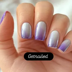 A stunning example of purple and silver chrome ombre. The colors blend seamlessly for a metallic, futuristic effect that is both bold and beautiful.