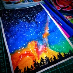 An expressive watercolor painting of a starry night sky over a forest silhouette. Even though I felt it was a 'bad attempt' at the time, I love the vibrant, unpredictable way the colors blended.