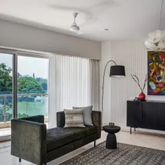 A versatile daybed is one of my favorite pieces of furniture. Here, it frames a beautiful view of the lake, creating a perfect spot for lounging.