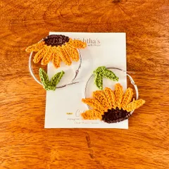 My unique sunflower hoop earrings, carefully crafted with thin cotton threads for maximum neatness and precision. They make a wonderful gift for a friend or yourself.