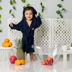 All clean and wrapped up in a cozy robe after his splash session. This is the perfect way to end a fun-filled photoshoot.