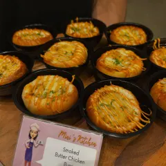Smoked Butter Chicken Buns. This is one of my signature fusion appetizers, combining a classic Indian flavor with a soft, modern bun. It's a guaranteed hit.
