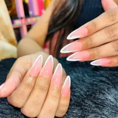 Clean, sharp, and absolutely timeless. This is my take on the classic French manicure, sculpted into a flawless stiletto shape. It’s a perfect example of the precision and attention to detail I bring to every set.