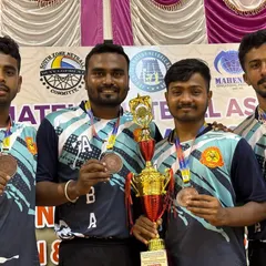 A close-up of our players Srujan, Hitesh, and Chiranjeevi Prakash with their hard-earned bronze medals and championship trophy.