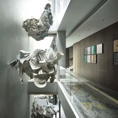 For us, art is a living, breathing element. This cascading installation, a collaboration with artist Ankon Mitra, combines the ancient Japanese dyeing technique of Shibori with the structural folds of origami to retell the story of Radha and Krishna, filling the home's central atrium with light, movement, and mythology.