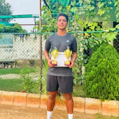 Arjun Bhati celebrating a double win at the CS7 Under-18 tournament, having won both the singles and doubles finals.