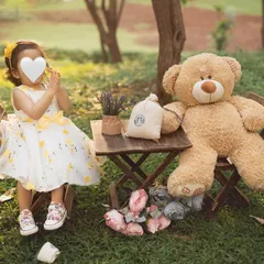 A playful moment during our teddy bear picnic. Outdoor sessions allow for so much movement and natural expression. (Face hidden for privacy).