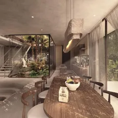The dining area in the House of Veils is an open, flowing space connected to a sunken living pit and an internal courtyard. The design uses a mix of warm wood and cool concrete to create a balanced and serene atmosphere.