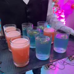 Colorful mocktails being served at a 5th birthday party. We offer a variety of non-alcoholic drinks that are popular with both kids and adults.