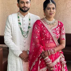 The handsome groom with his beautiful bride.