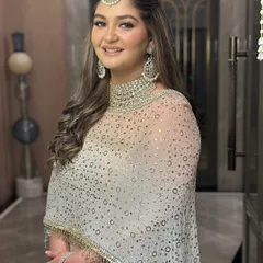 A happy and radiant bride-to-be. The makeup is designed to look flawless and glowing from every angle, perfect for celebrating this special milestone.